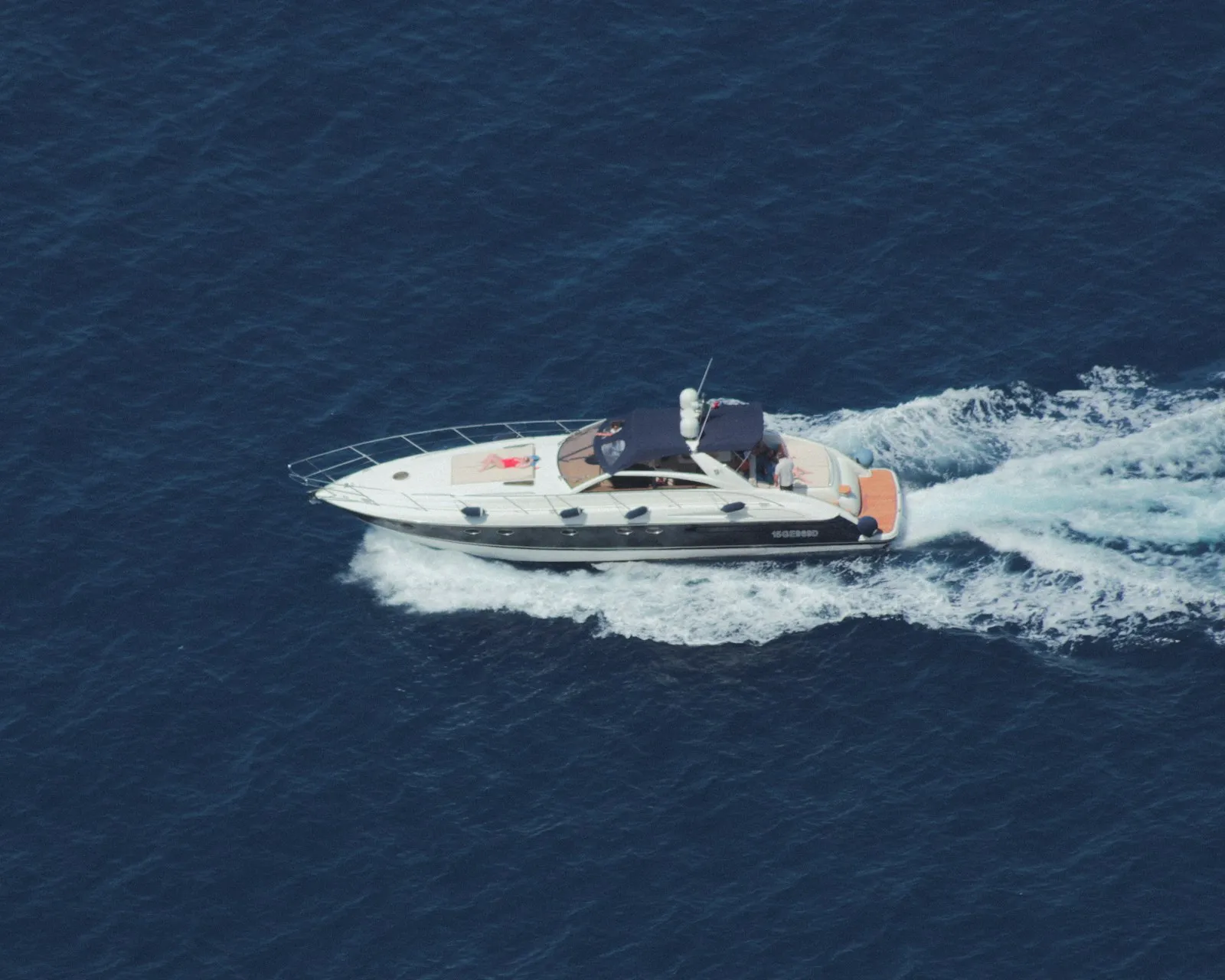 A cruiser powerboat underway on open water